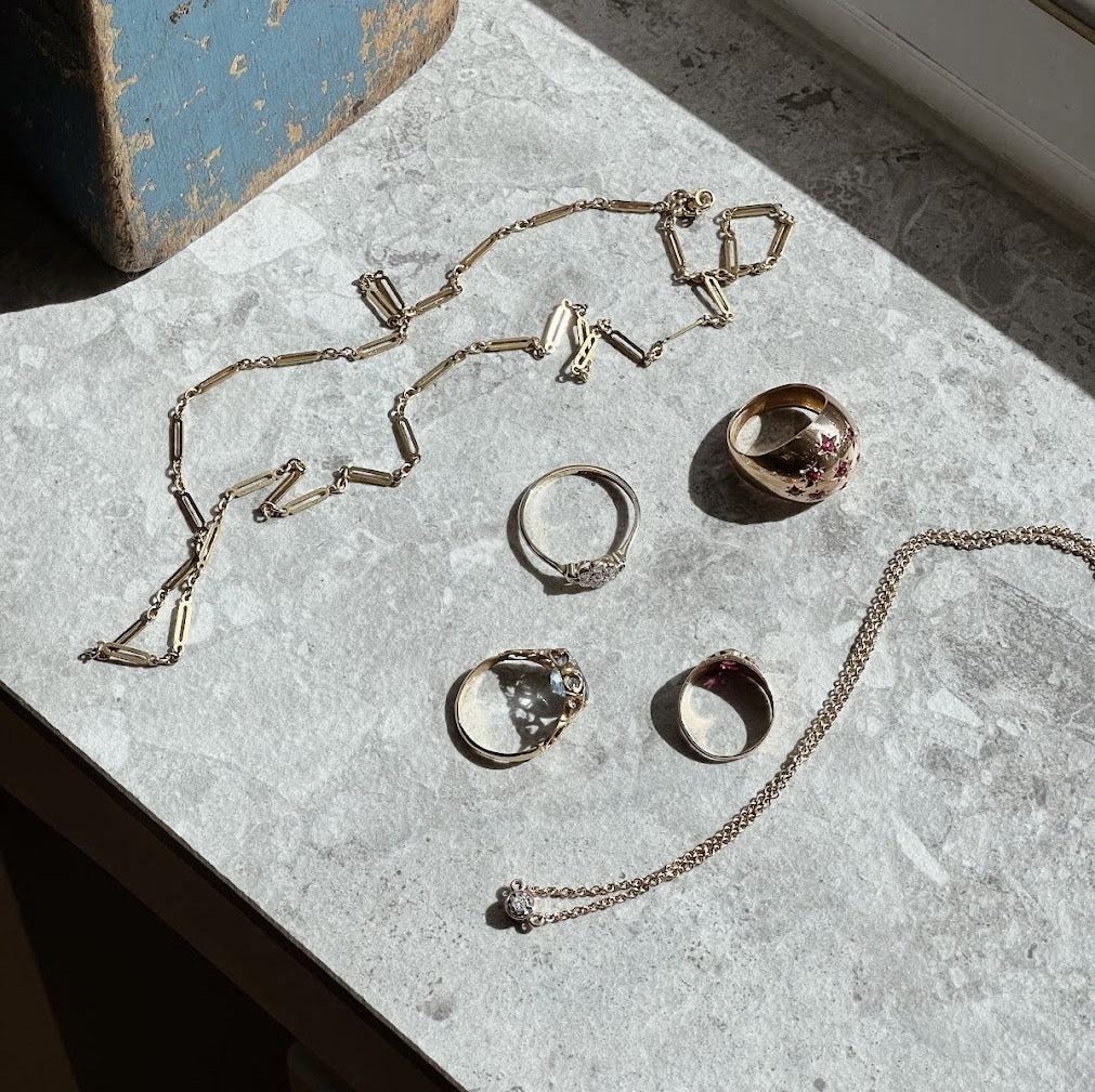 Vintage gold jewellery in sunlight